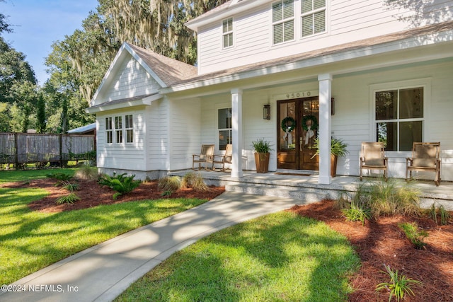 view of front of home with a front lawn and covered porch