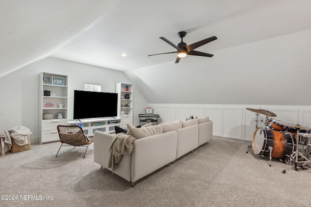 carpeted living room featuring ceiling fan, built in features, and lofted ceiling