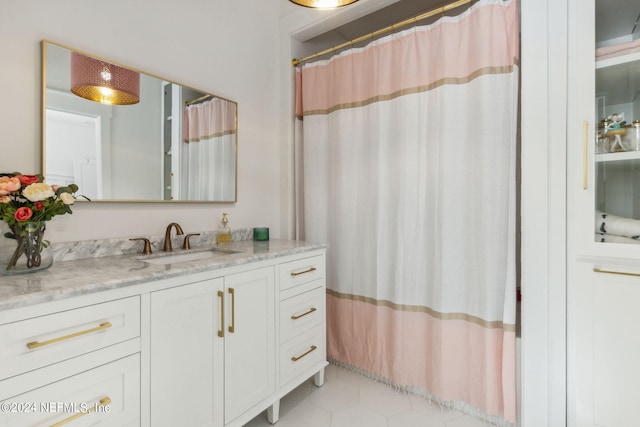 bathroom featuring vanity and a shower with curtain