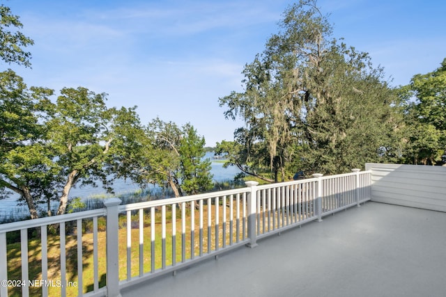 view of patio / terrace featuring a balcony and a water view