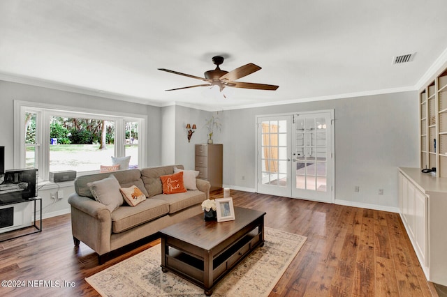 living room featuring crown molding, hardwood / wood-style flooring, and ceiling fan