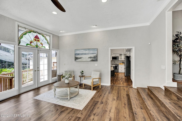 3565 Red Cloud Trl, Saint Augustine, FL 32086 - living room featuring a ceiling fan, french doors, dark wood-style floors, and crown molding