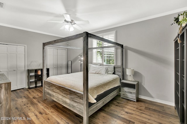 bedroom featuring dark wood-type flooring, ceiling fan, and crown molding