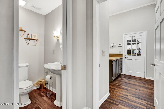 bathroom with wood-type flooring and toilet