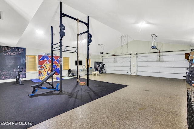 3565 Red Cloud Trl, Saint Augustine, FL 32086 - workout area featuring vaulted ceiling and a garage