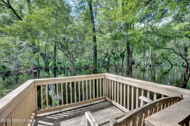 wooden deck with a water view