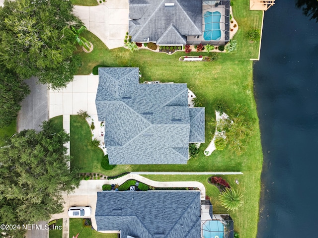 birds eye view of property featuring a water view