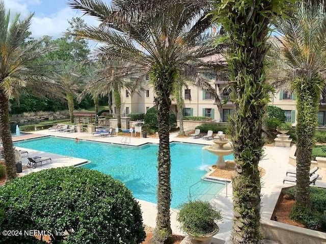 view of swimming pool with a patio area