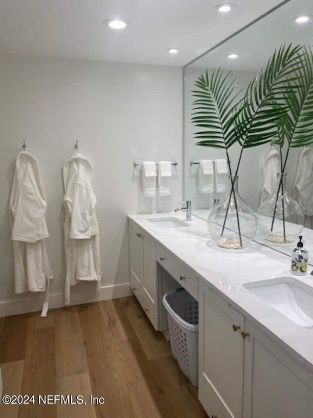 bathroom with vanity and hardwood / wood-style floors