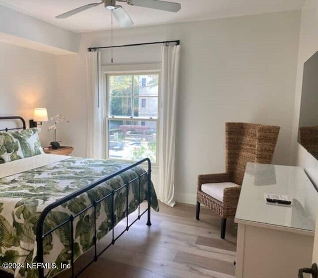 bedroom featuring ceiling fan and light hardwood / wood-style flooring