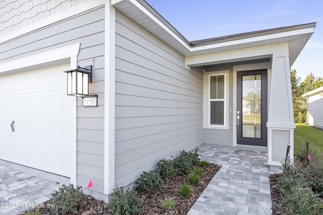 entrance to property featuring a garage