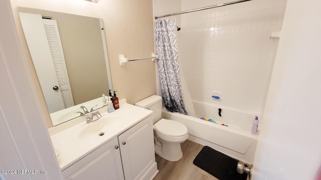 full bathroom with vanity, hardwood / wood-style floors, toilet, and shower / bath combo