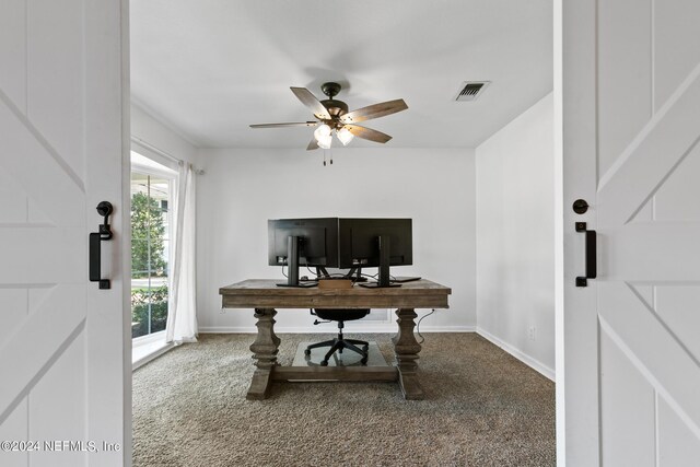 carpeted office with ceiling fan