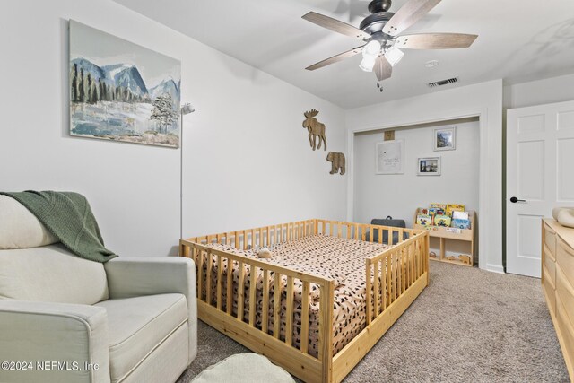 carpeted bedroom with ceiling fan