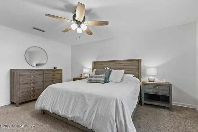 bedroom with ceiling fan and carpet