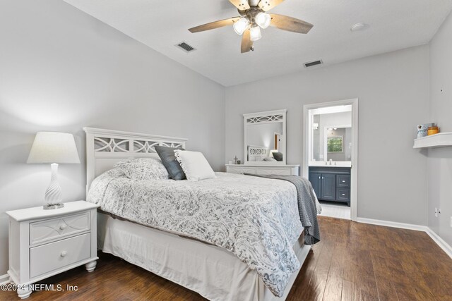 bedroom featuring connected bathroom, ceiling fan, dark wood-type flooring, and sink