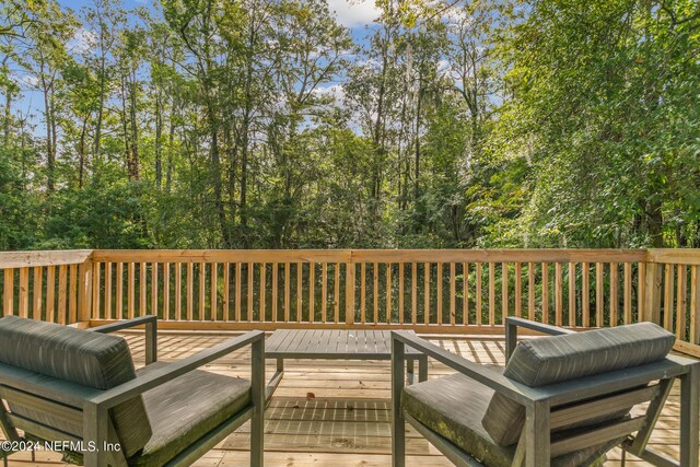 wooden deck featuring an outdoor living space