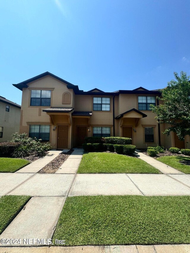 view of front of home with a front yard