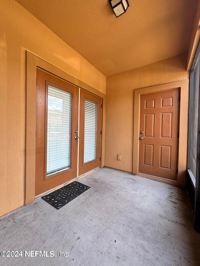 entrance to property with a patio