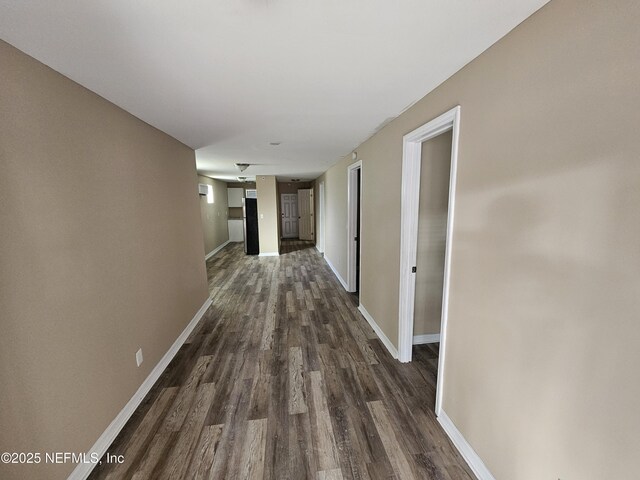 hallway featuring dark wood-type flooring