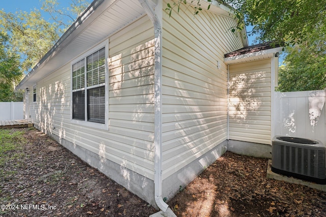 view of side of home featuring central AC unit