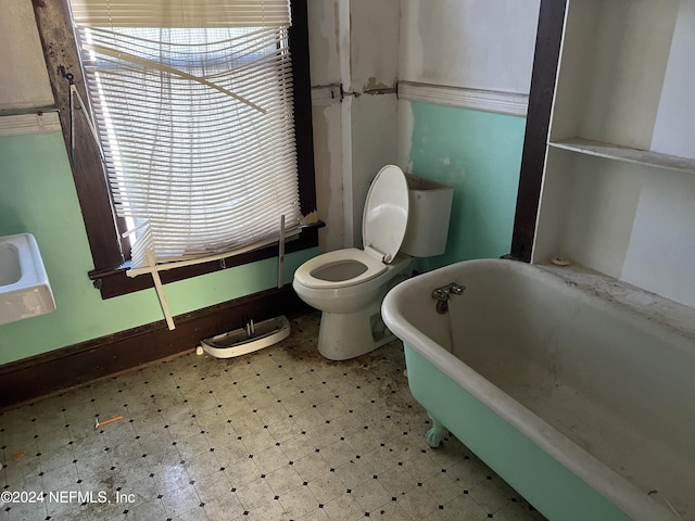 bathroom featuring a bathing tub and toilet