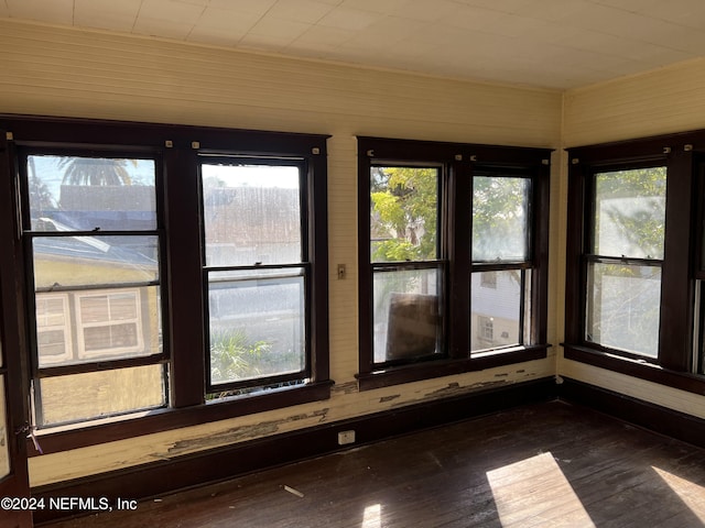 unfurnished sunroom with plenty of natural light