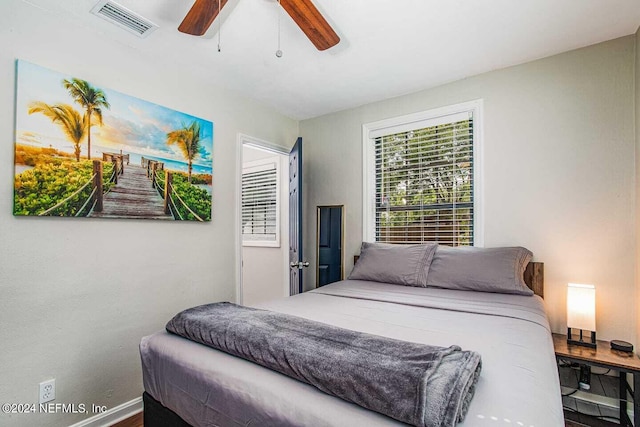 bedroom featuring wood-type flooring and ceiling fan