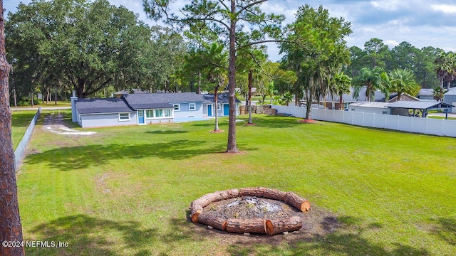 view of yard featuring a fire pit