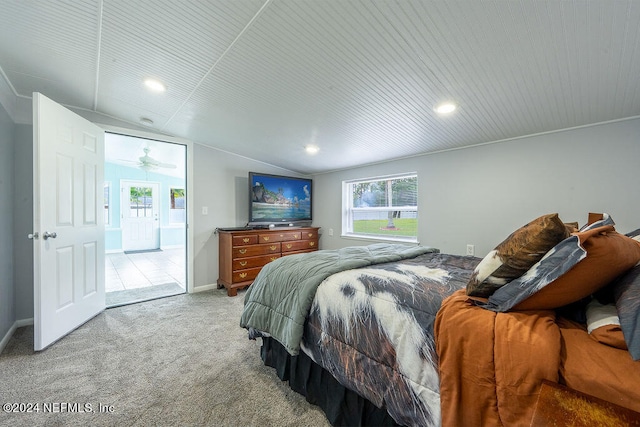 carpeted bedroom featuring lofted ceiling