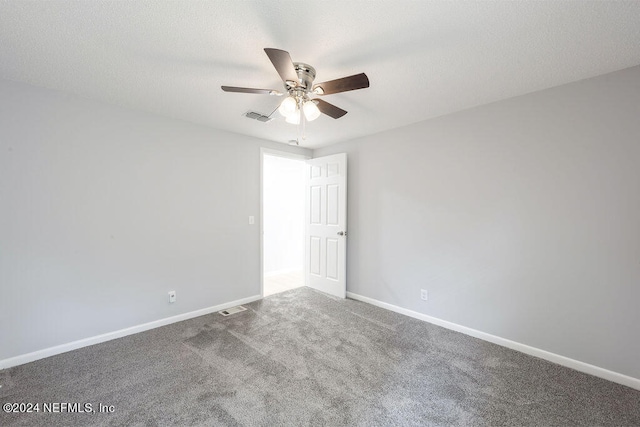 empty room featuring carpet and ceiling fan