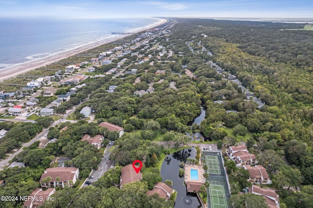 birds eye view of property featuring a water view and a view of the beach