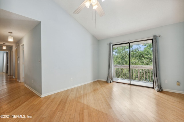 spare room with ceiling fan, light wood-type flooring, and lofted ceiling