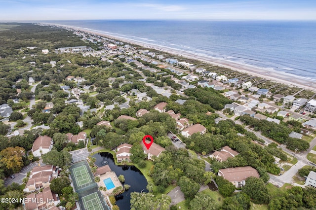 bird's eye view featuring a water view and a view of the beach