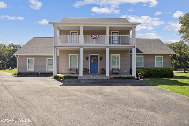 view of front of home with a balcony