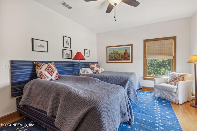 bedroom with ceiling fan and hardwood / wood-style floors