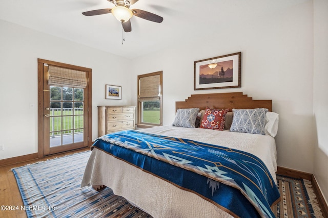 bedroom featuring ceiling fan, wood-type flooring, and access to outside