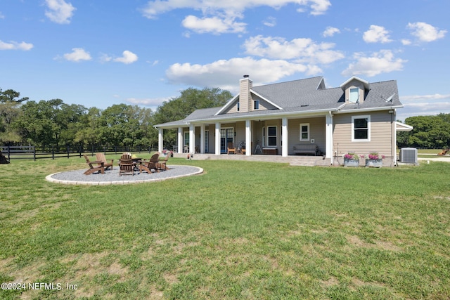 back of house featuring a yard, a patio, and central AC unit