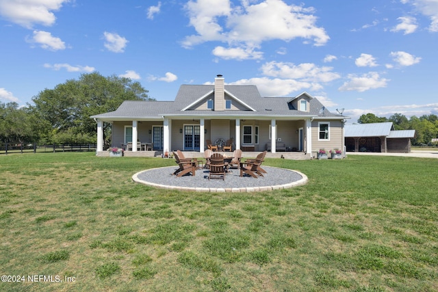 back of house featuring a lawn