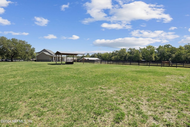 view of yard with a rural view