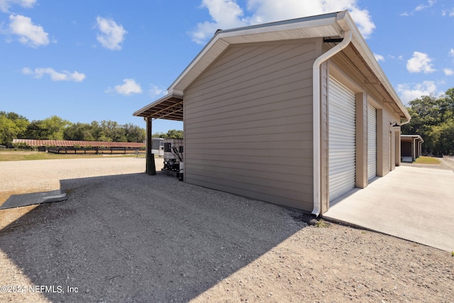 view of property exterior with a garage