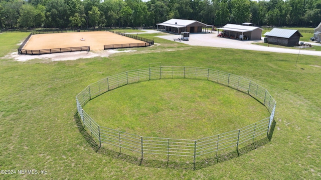 birds eye view of property with a rural view