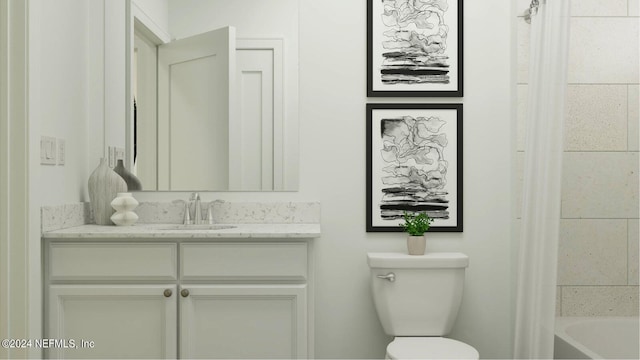 bathroom with vanity and toilet