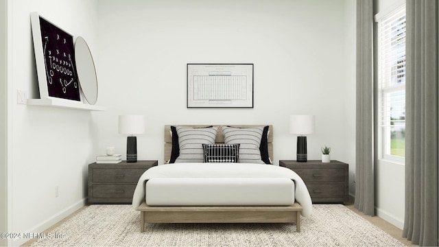 carpeted bedroom featuring multiple windows