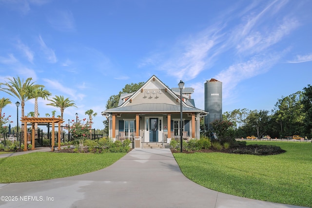 view of front of property with a porch and a front lawn