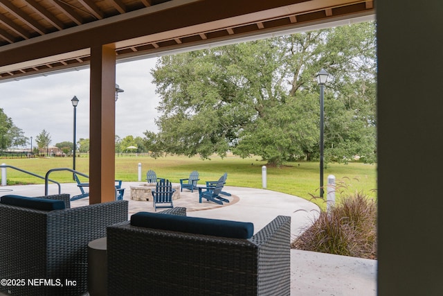 view of patio with an outdoor fire pit