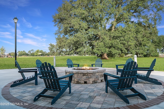 view of patio with a fire pit