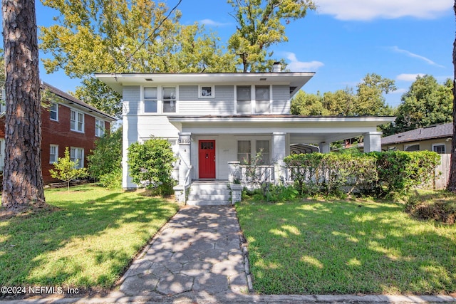 view of front of home featuring a front lawn and covered porch