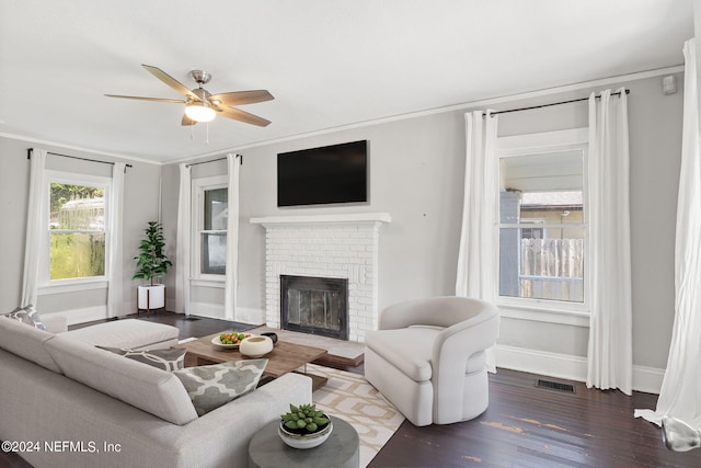 2859 Lydia St, Jacksonville, FL 32205 - living area with crown molding, wood finished floors, a brick fireplace, visible vents, and ceiling fan