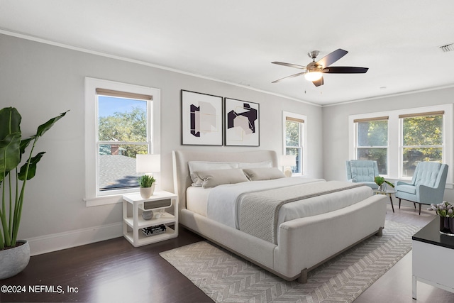 bedroom with ornamental molding, multiple windows, ceiling fan, and dark hardwood / wood-style flooring